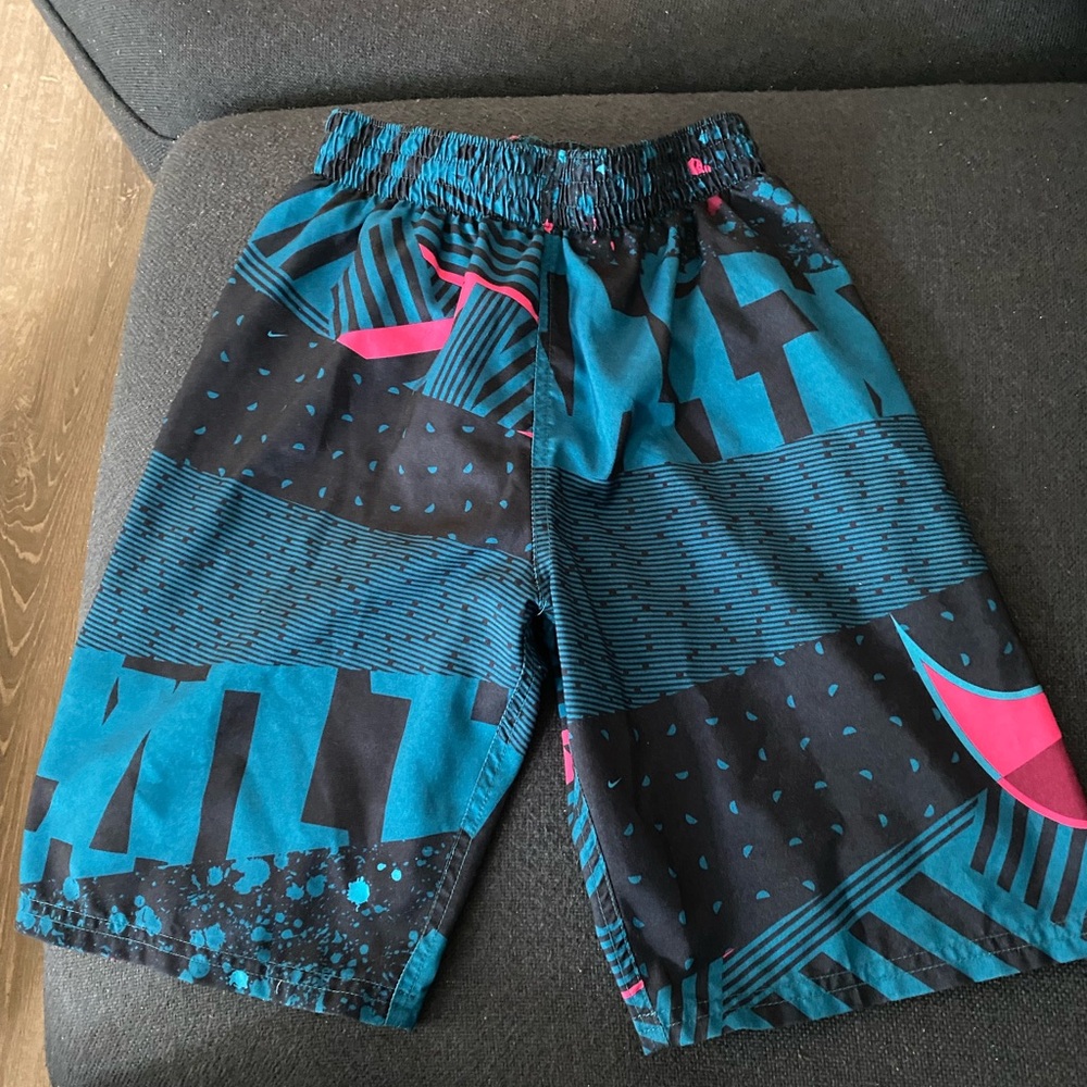 Nike Swim Trunks. Barely worn. Grandson wore at 13. Believe size M. Cut tag out.